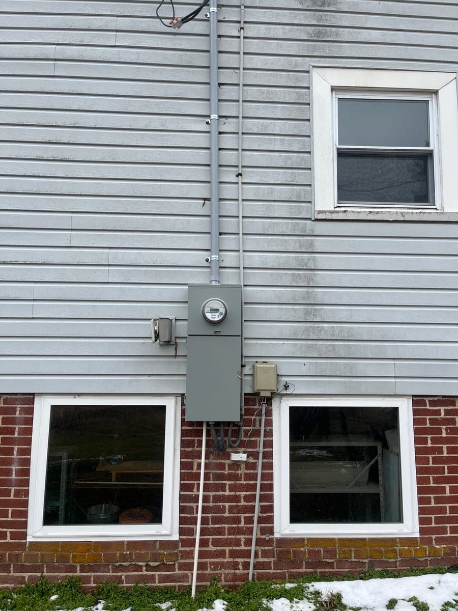 Residential exterior meter and electrical service upgrade on a home