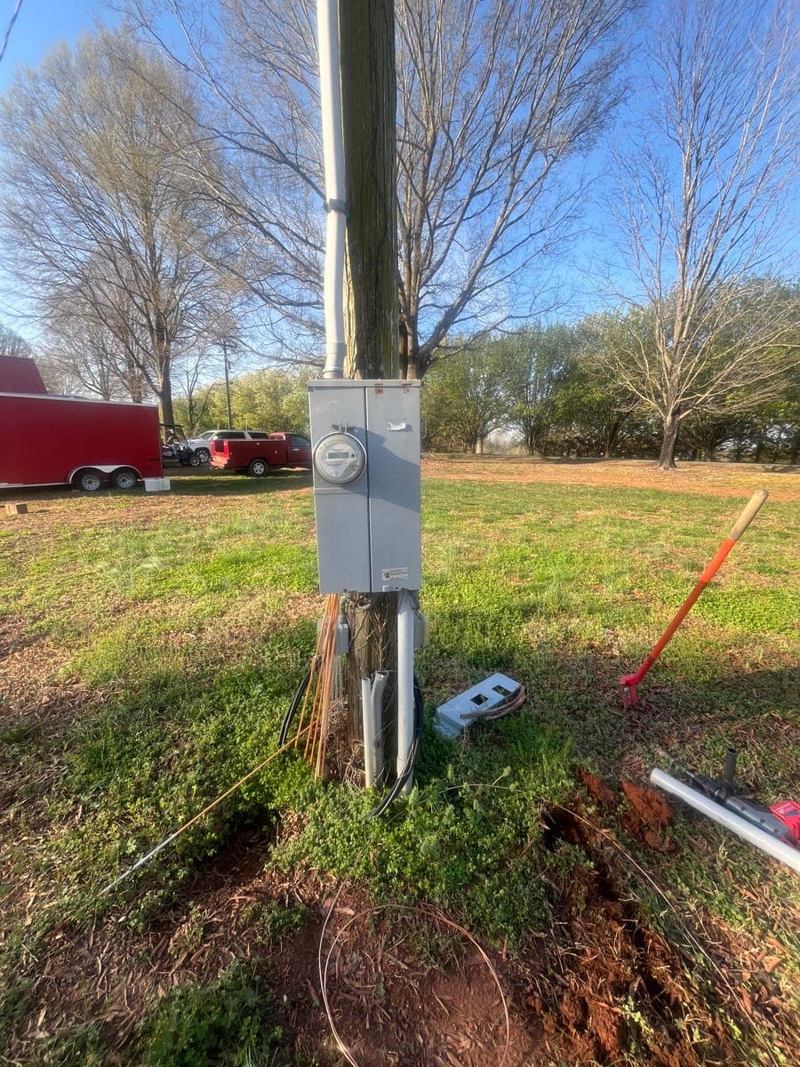 Outdoor electrical meter and service equipment near a utility pole