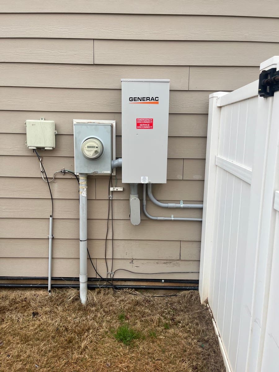 Exterior meter, disconnect, and electrical service equipment installed on siding