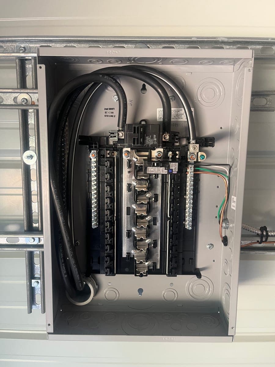 Open residential electrical panel with clean, organized wiring